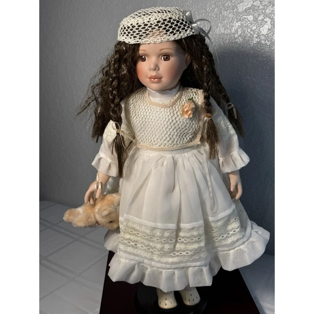 Porcelain Doll Girl in White Dress Bonnet Brown Braided Hair Light Complexion